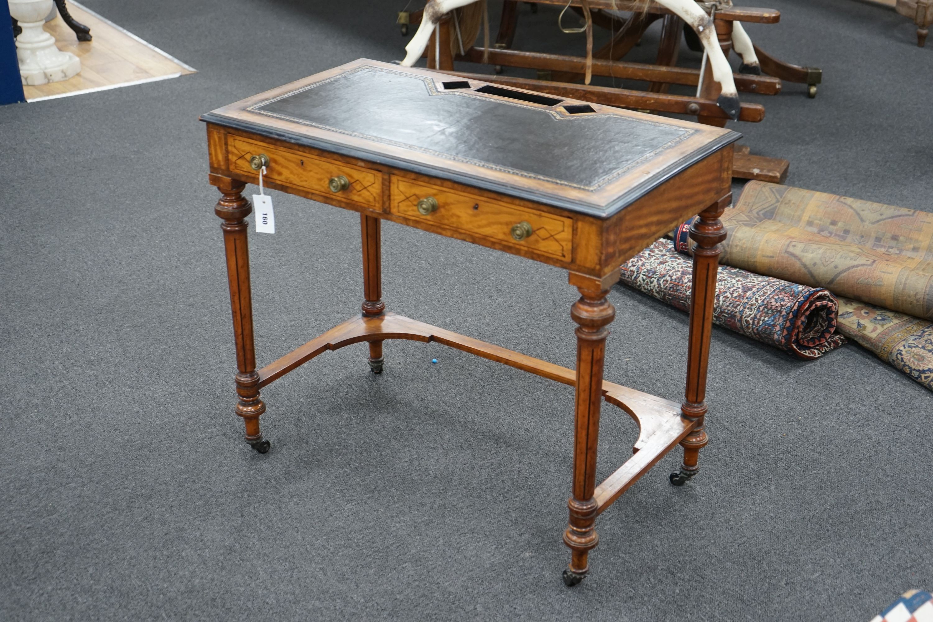 An Edwardian satinwood two drawer writing table, width 83cm, depth 45cm, height 72cm